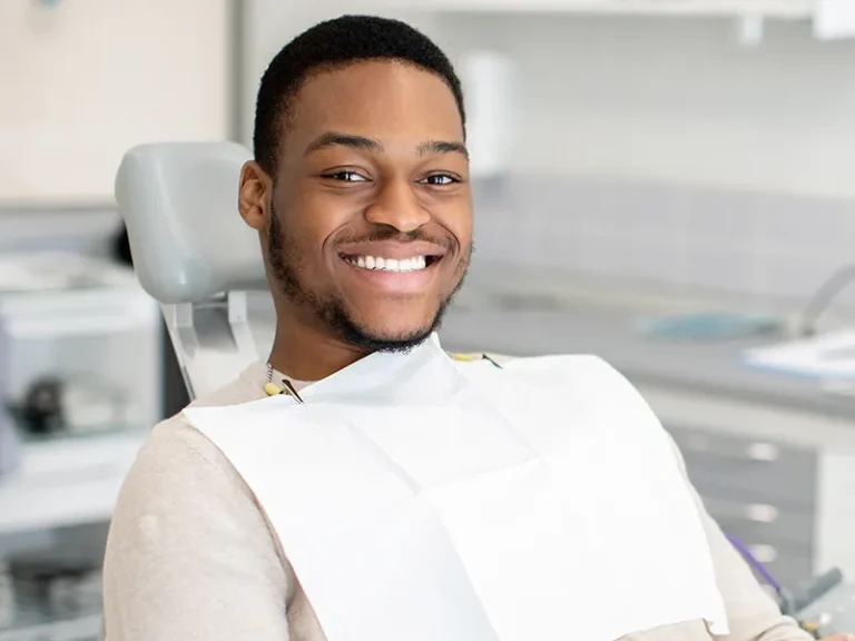 Happy patient smiling after visit with cosmetic dentist in Bellingham at Roots Dental.