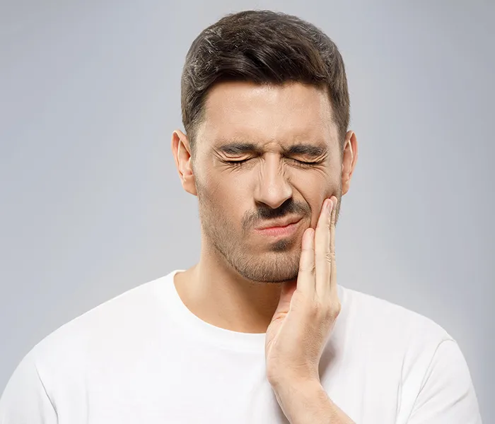 Emergency - Man with tooth pain needing urgent care from an emergency dentist in Bellingham.