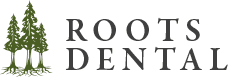 Roots Dental logo featuring green tree design and modern lettering for dental clinic in Bellingham.